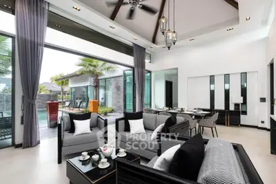 Luxurious open-plan living room with pool view and elegant decor