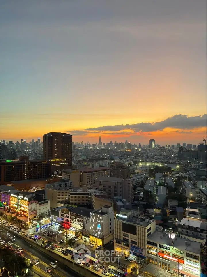 Stunning cityscape view at sunset with vibrant skyline and bustling streets.