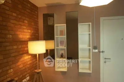 Stylish living room with brick accent wall and modern shelving