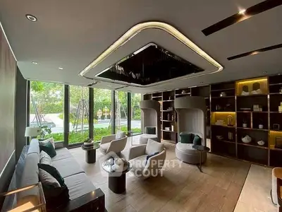Luxurious living room with modern decor and garden view, perfect for relaxation and entertainment.