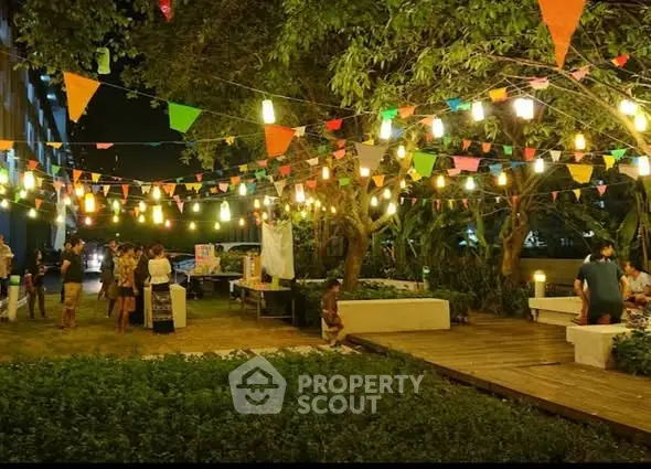 Charming garden with festive lights and vibrant decorations for a lively outdoor event.