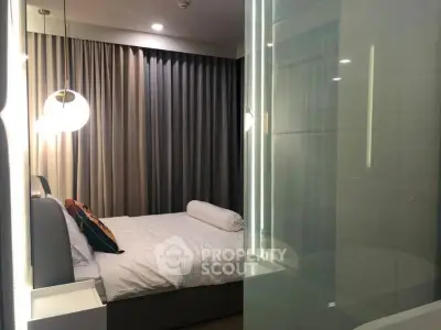 Modern bedroom with stylish lighting and elegant curtains
