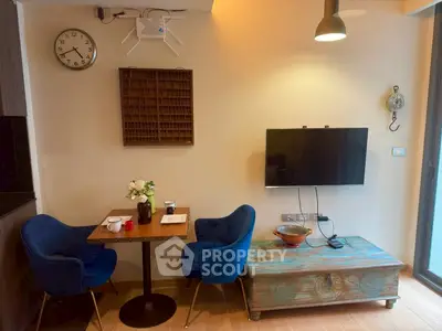 Cozy living room with modern decor and blue chairs