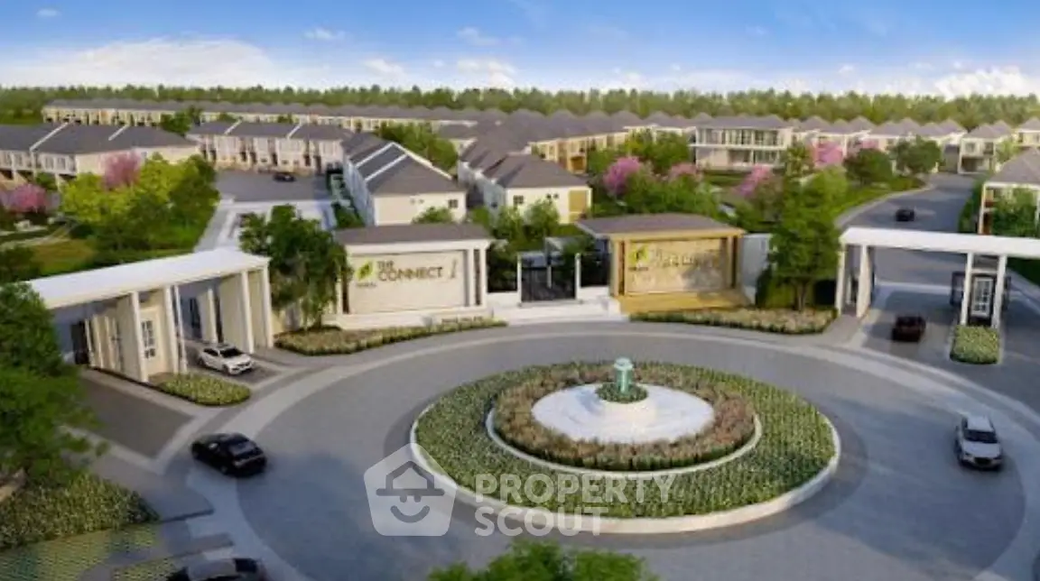 Luxurious residential community entrance with landscaped roundabout and modern architecture.