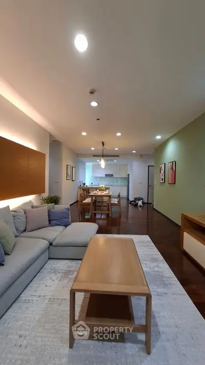 Spacious modern living room with open kitchen and stylish decor