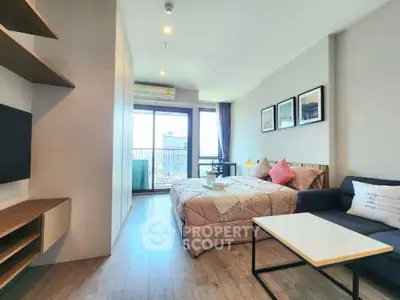 Modern studio apartment with cozy bedroom and balcony view