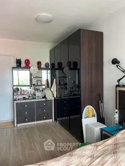 Modern bedroom with sleek wardrobe and stylish decor