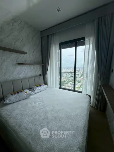 Modern bedroom with stunning city view from large window