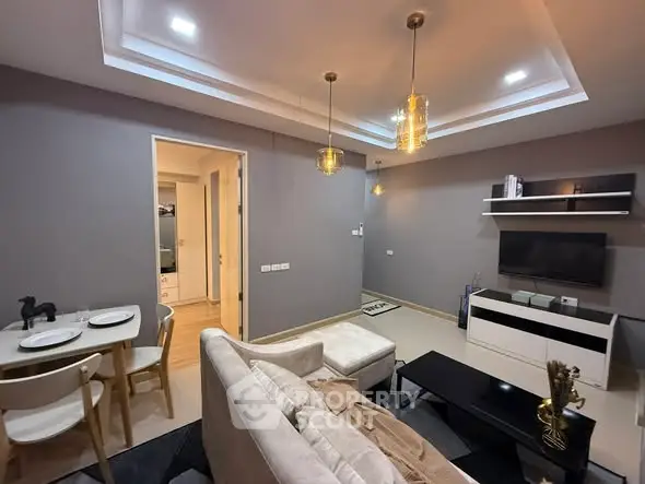 Modern living room with stylish lighting and cozy seating area