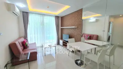 Modern living room with sleek furniture and ambient lighting in a stylish apartment.
