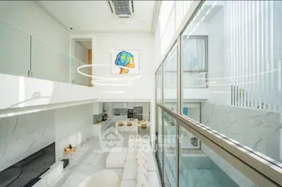 Luxurious modern living room with high ceilings and open kitchen layout