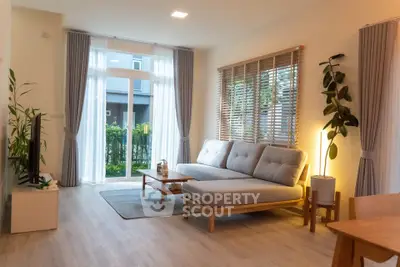 Modern living room with stylish furniture and large windows for natural light.