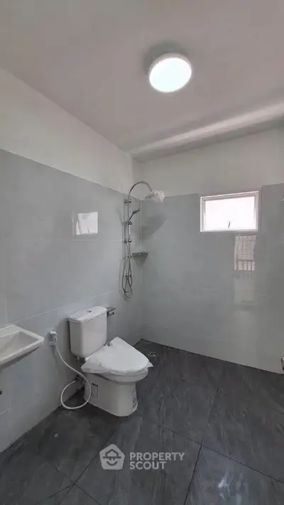 Modern bathroom with sleek gray tiles and contemporary fixtures