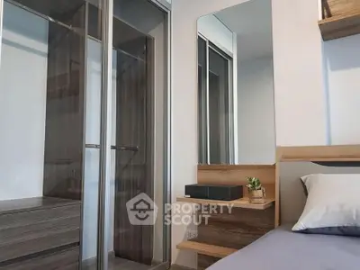 Modern bedroom with sleek wardrobe and stylish decor