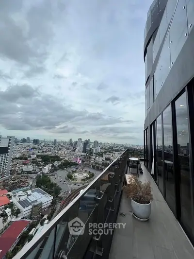 Stunning high-rise balcony with panoramic city views, perfect for urban living enthusiasts.
