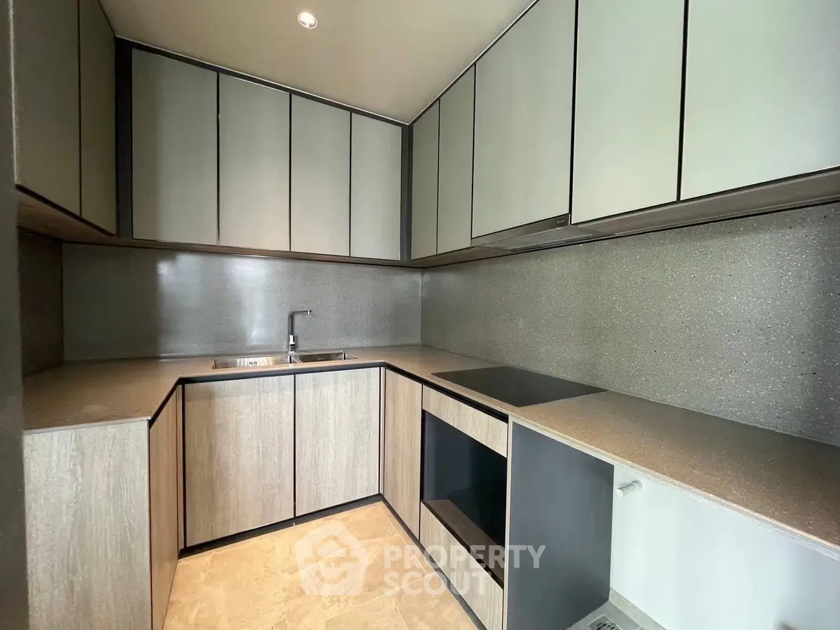Modern kitchen with sleek cabinetry and integrated appliances