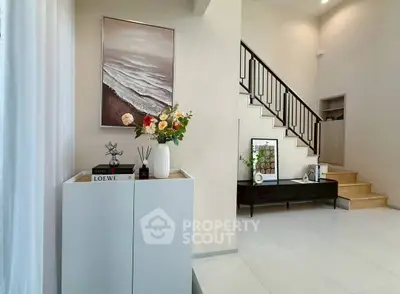 Elegant modern interior with stylish staircase and decor, perfect for contemporary living.