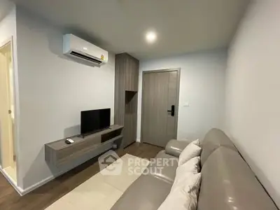 Modern living room with sleek furniture and air conditioning