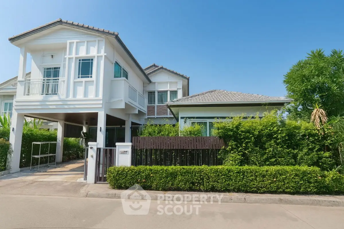 Stunning modern house with lush greenery and elegant architecture in a serene neighborhood.