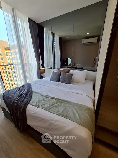 Luxurious bedroom with floor-to-ceiling windows and modern decor
