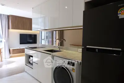 Modern kitchen with sleek appliances and open layout in stylish apartment