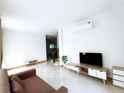 Spacious modern living room with sleek furniture and natural light