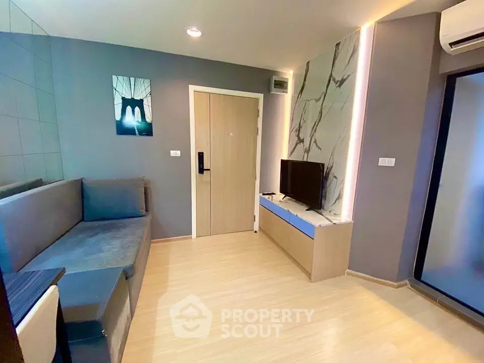 Modern living room with stylish decor and sleek furniture in a contemporary apartment.