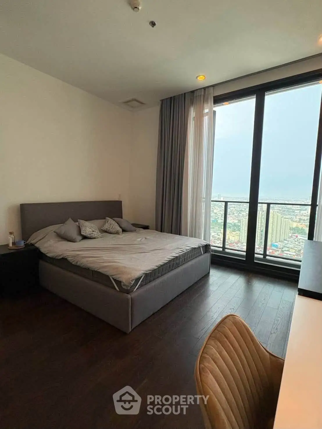 Luxurious bedroom with stunning city view and modern furnishings