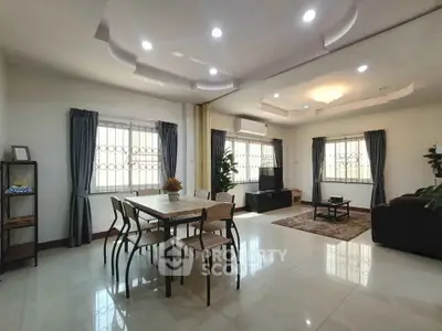 Spacious modern living room with elegant dining area and stylish decor
