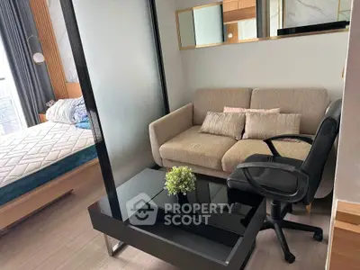 Modern studio apartment with cozy living area and stylish decor