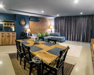 Spacious modern living room with stylish dining area and cozy seating.