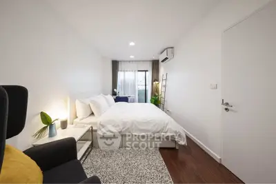 Modern bedroom with cozy decor, featuring a plush bed, stylish lighting, and a serene ambiance.