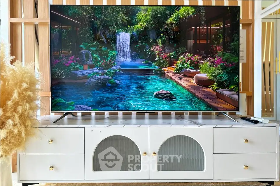 Modern living room with stylish TV unit and vibrant nature scene on screen