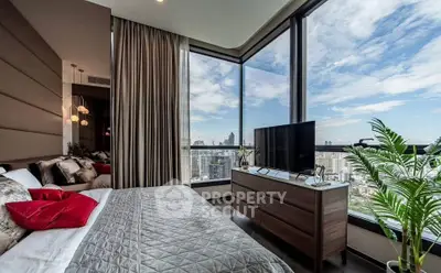 Luxurious bedroom with panoramic city views and modern decor