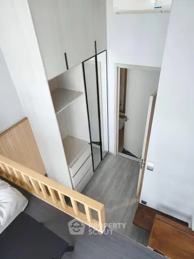 Modern bedroom with sleek wardrobe and minimalist design
