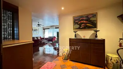 Spacious living room with elegant decor and wooden flooring