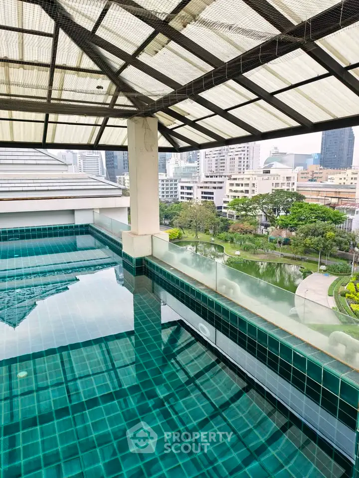 Luxurious rooftop pool with stunning cityscape views in modern urban setting.