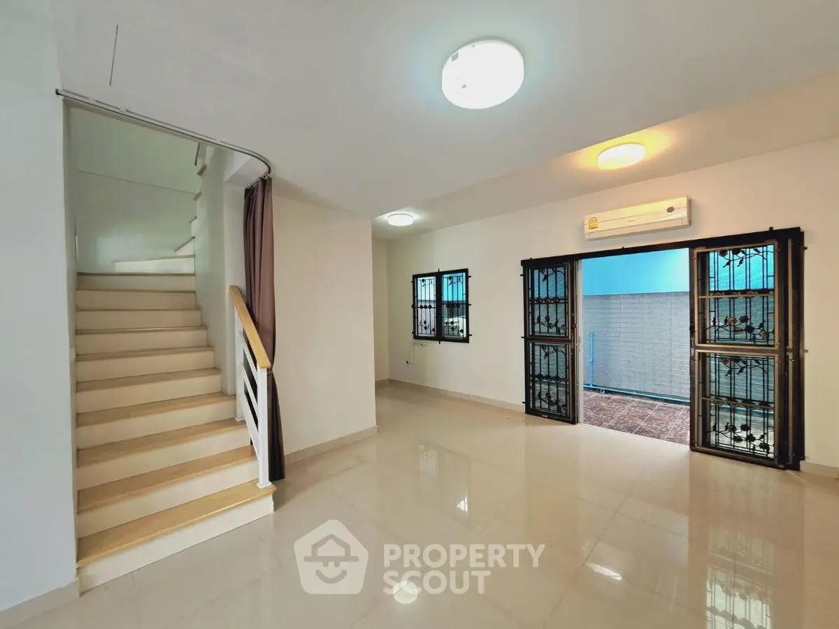 Spacious interior with staircase and air-conditioned living area, perfect for modern living.