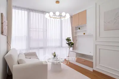 Elegant living room with modern decor and large windows for natural light