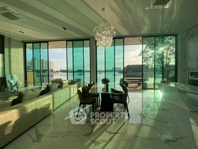 Luxurious living room with stunning waterfront view and elegant modern decor