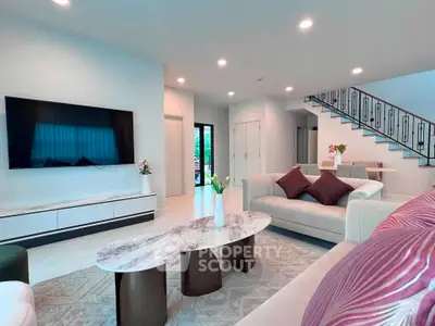 Spacious modern living room with elegant decor and large TV