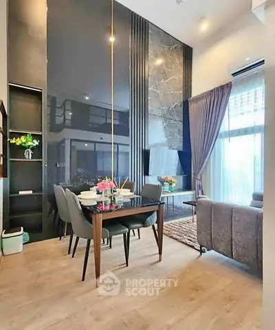Luxurious modern living room with high ceilings and elegant decor