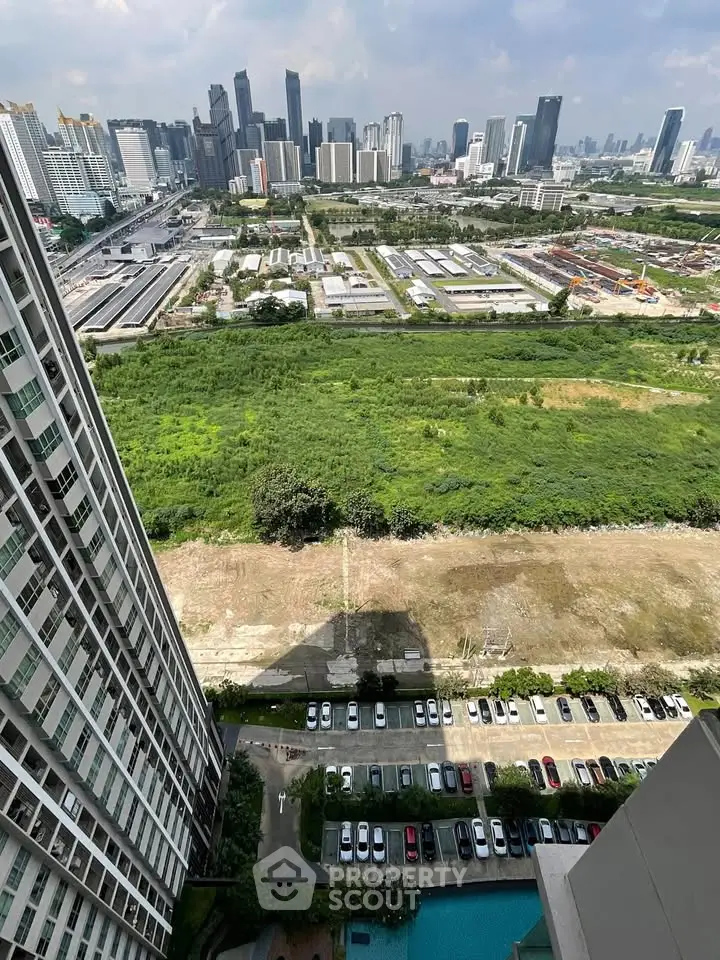 Stunning high-rise cityscape view with lush greenery and urban skyline, perfect for modern living.