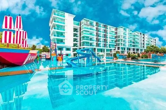 Luxurious waterfront apartment complex with stunning pool and vibrant play area.
