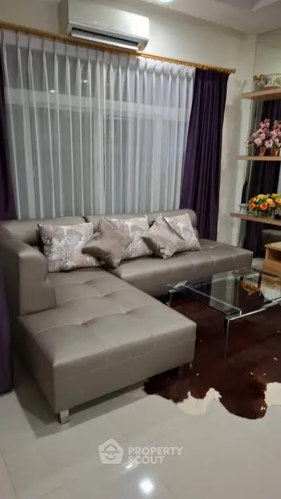 Elegant living room with modern L-shaped sofa and chic decor