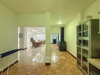 Spacious open-layout living area with dining space and modern furnishings