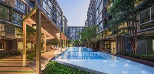 Luxurious modern apartment complex with stunning pool and lush greenery