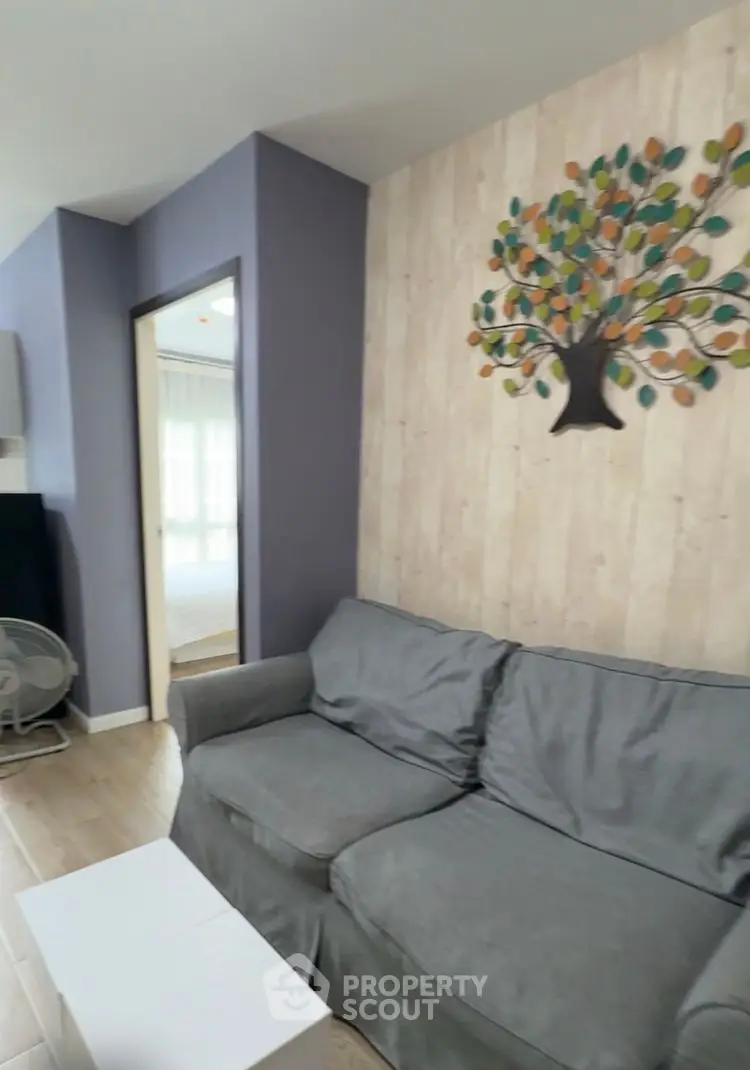 Cozy living room with modern decor and comfortable sofa, perfect for relaxation.