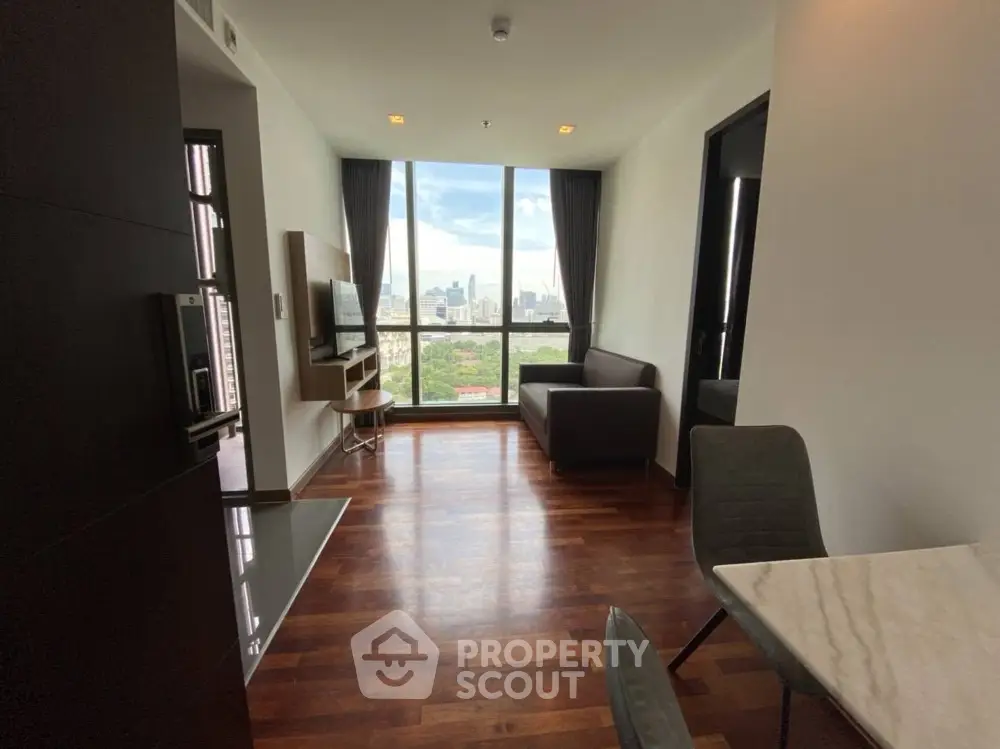 Modern living room with city view and wooden flooring
