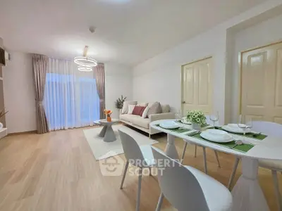 Modern living room with elegant dining area and stylish decor